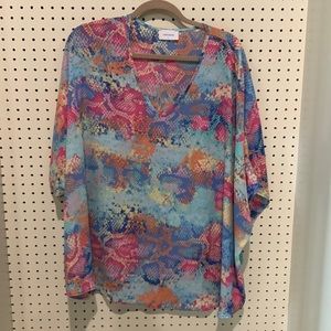 Boutique top, Large oversized, can tie bottom in a knot.